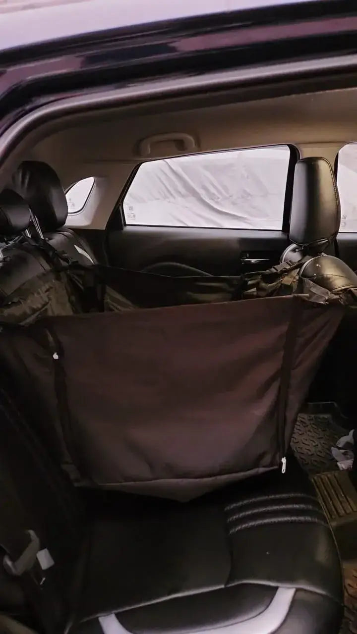 Car interior with a black seat cover on a black car seat