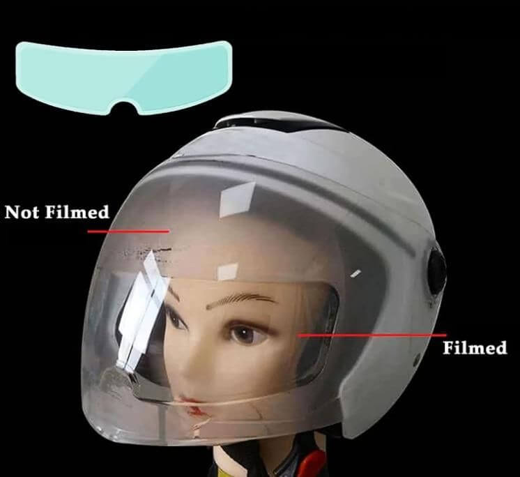 Motorcycle helmet showcasing anti-fog film contrast, highlighting the 'filmed' and 'not filmed' sections.