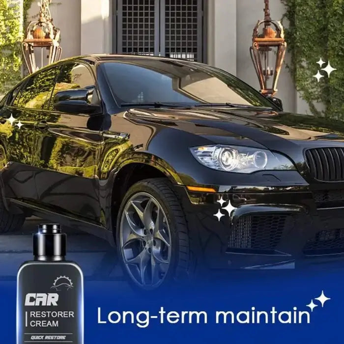 Black car with a bottle of car restorer cream in front of a house.
