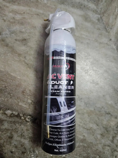 A can of duct cleaner on a concrete floor