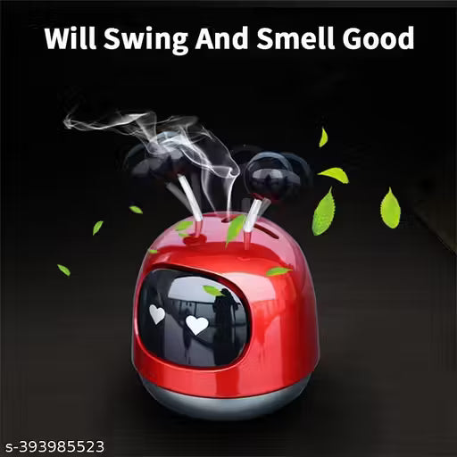 Red humidifier with steam and leaves on a black background