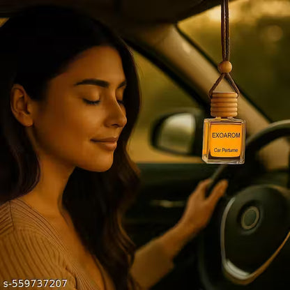 Woman in a car with an EXOAROM car perfume hanging from the rearview mirror.
